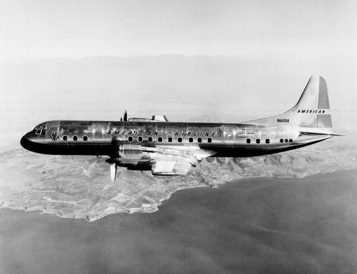 View of two-engine commercial aircraft in flight. Aircraft features American Airlines livery.