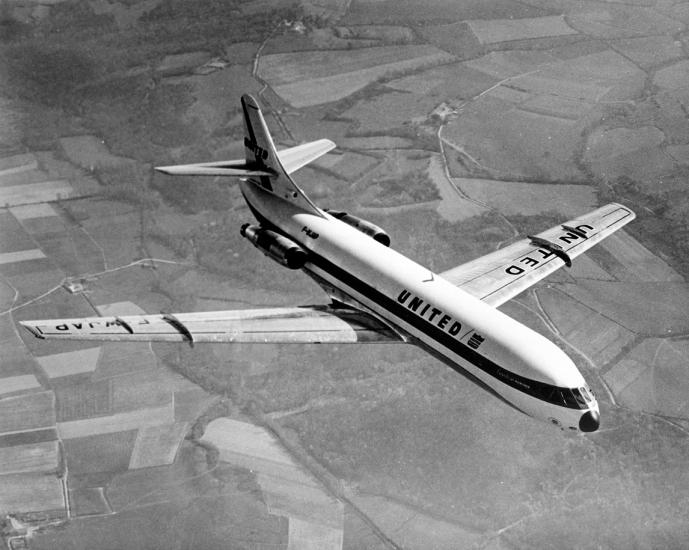 Top view of commercial aircraft with two engines, one each on the rear of the fuselage. Aircraft is in flight and features United Airlines livery.