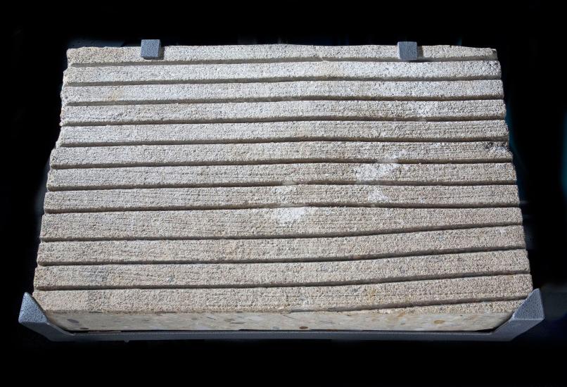 Section of concrete with grooved lines used in testing whether they would remove water on aircraft runaways.