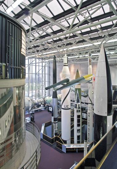 Several rockets are seen from above, looking down into the Space Race gallery.