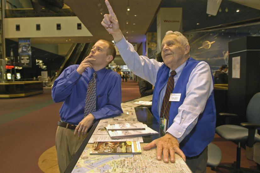 Don Lopez Helping Visitor at the Welcome Center