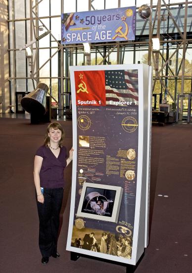 Margaret Weitekamp in front of Sputnik kiosk