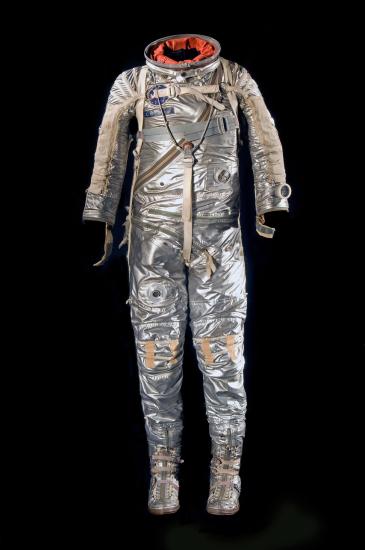 Silver-coated, full-body flight suit with various spots for tubes to be placed. 