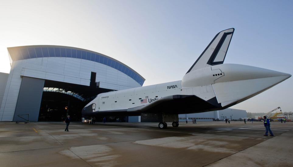 The Space Shuttle Enterprise is taken out of the Steven F. Udvar-Hazy Center prior to the placement of the Space Shuttle Discovery.