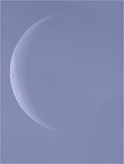 View of the Moon during waning crescent phase during daytime hours.