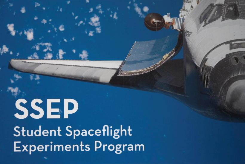 Graphic with a space shuttle in flight in the sky with clouds. Below the wing of the space shuttle the acronym "SSEP" is mentioned above its meaning: "Student Spaceflight Experiments Program".