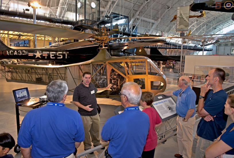 An expert curator gives a presentation at the Udvar-Hazy Center as part of his job responsibilities.