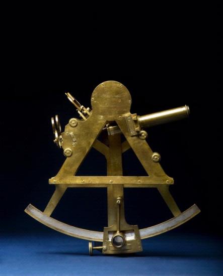 Gold-colored navigational tool shaped similar to a sector of a circle.