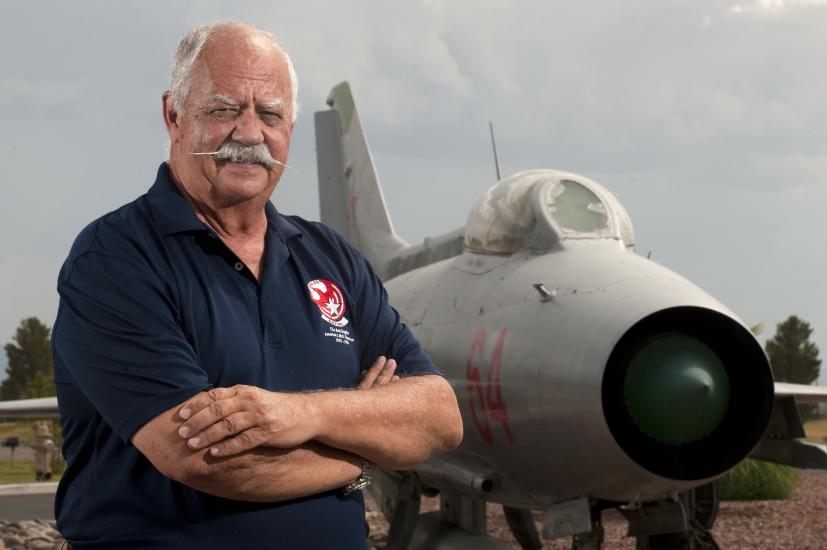 Portrait of Col. Gaillard R. Peck, Jr., USAF, a white man, in front of aircraft