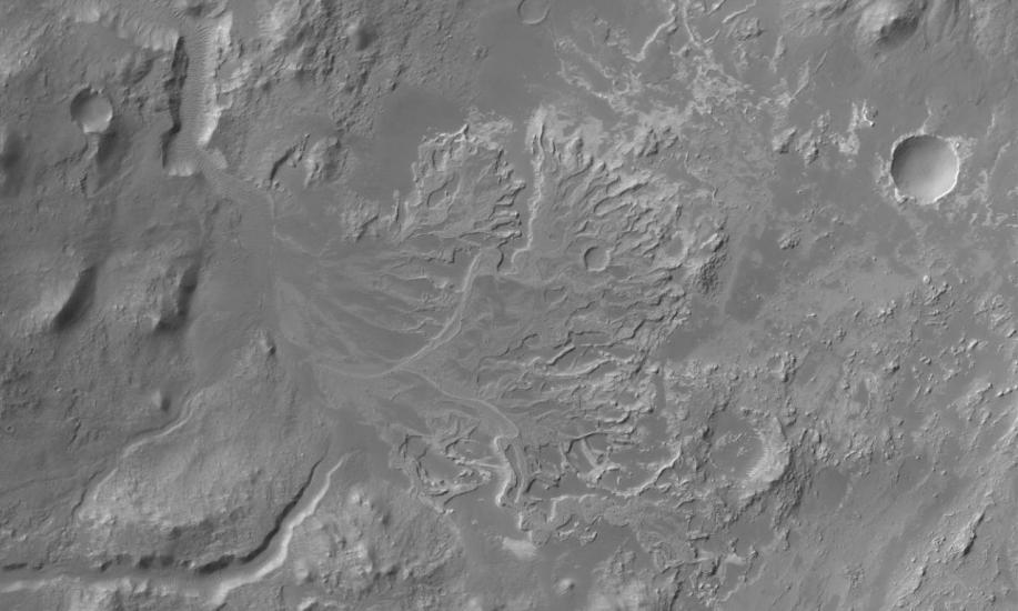 Satellite view of part of Mars's current landscape, featuring impact craters which once held bodies of water like rivers and lakes.