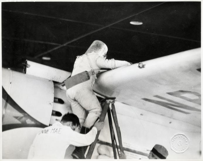 Wiley Post Climbing into the Winnie Mae with his Pressure Suit