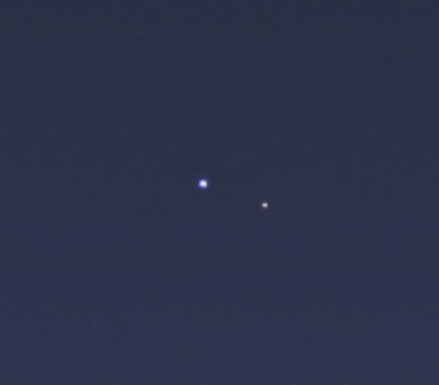 A view of Earth and its Moon from the orbit of Saturn.