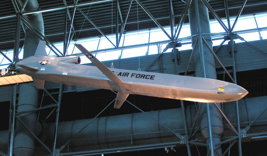 Silver-colored metallic missile with small set of center wings displayed in the Museum.