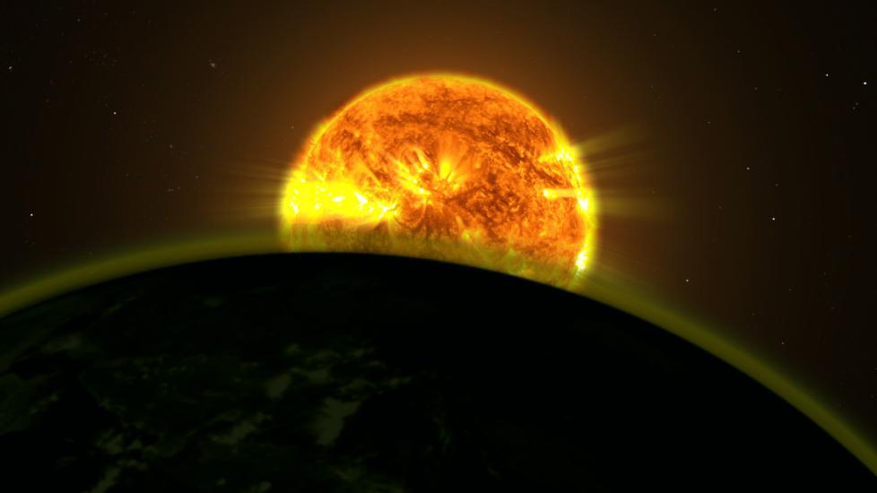 An illustration of the light of a star illuminating a planet with a hazy appearance.