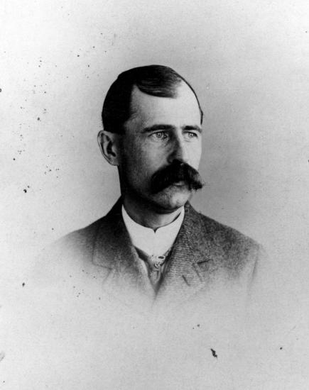 Black and white portrait of Reuchlin Wright, a white male.