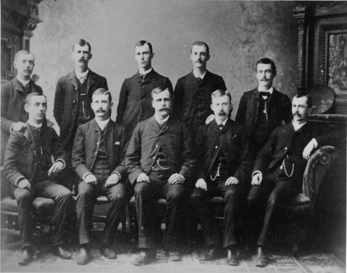 A group of ten white men known collectively as the 'Ten Dayton Boys'. Wilbur Wright was a member of this group, alongside his two older brothers, Reuchlin and Lorin.