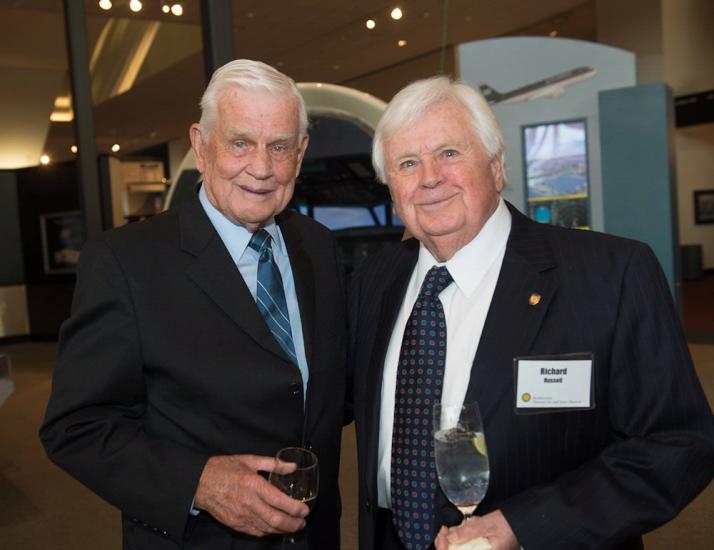 Richard Russell and Col. Bud Anderson, both white men, stand together at a lecture hosted by the museum.