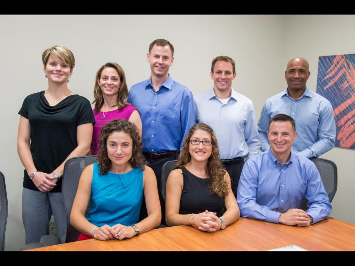 Eight people, who all are part of the 2013 NASA astronaut class, pose as a group.