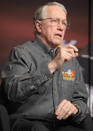 Richard Fisher, a white man, speaks during a briefing.