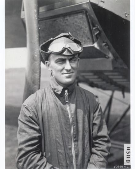 Lt. Oakley Kelly, a white man, stands while wearing aviator gear.