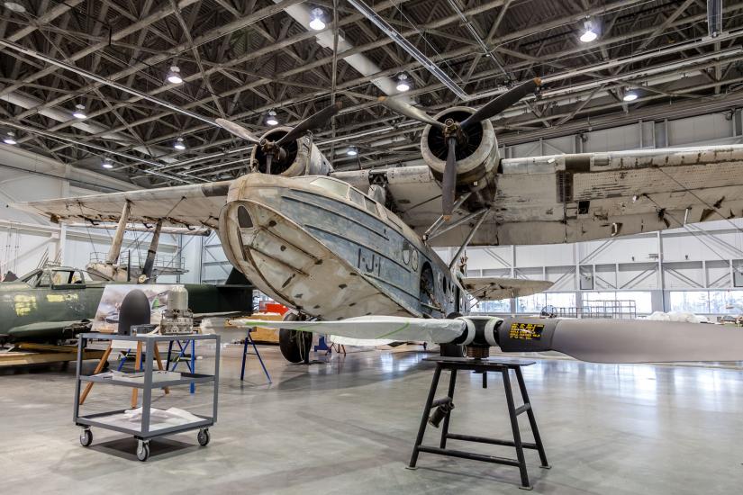 A monoplane with two twin engines sits in the Museum's restoration hangar, where it receives work to refurbish the aircraft prior to its display in the Museum.