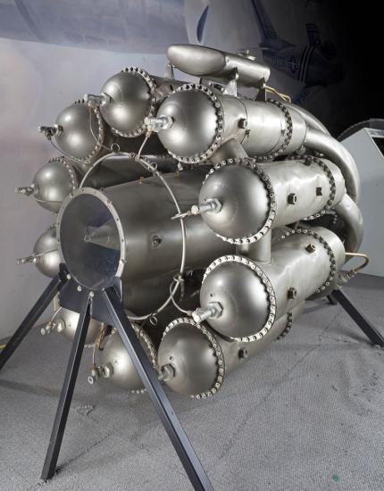 Silver-colored, metal, ten-cylinder engine used for turbojets.