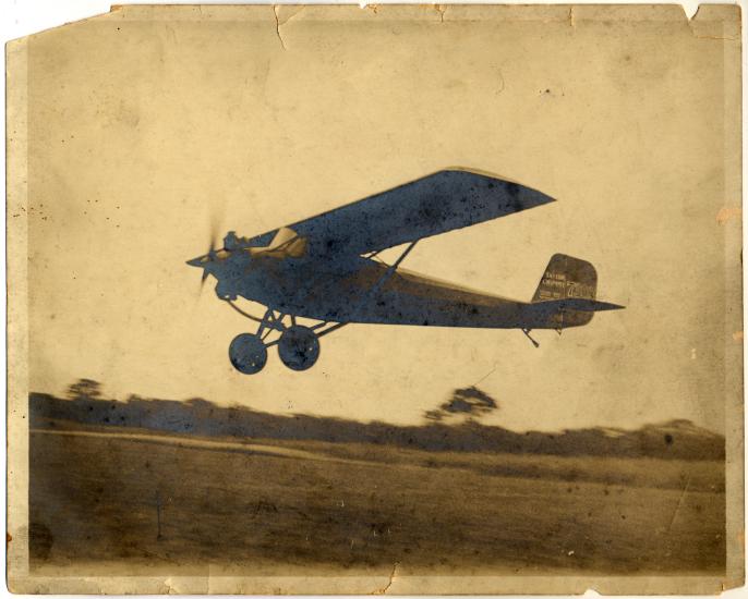 Monoplane with one engine. Monoplane is slightly above the ground.