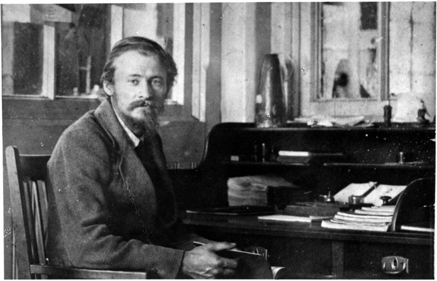 Friedrich Tsander, a white male physicist, sits near a desk.