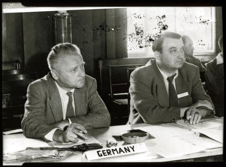 Eugen Sänger, a white male engineer, sits at a table near others.