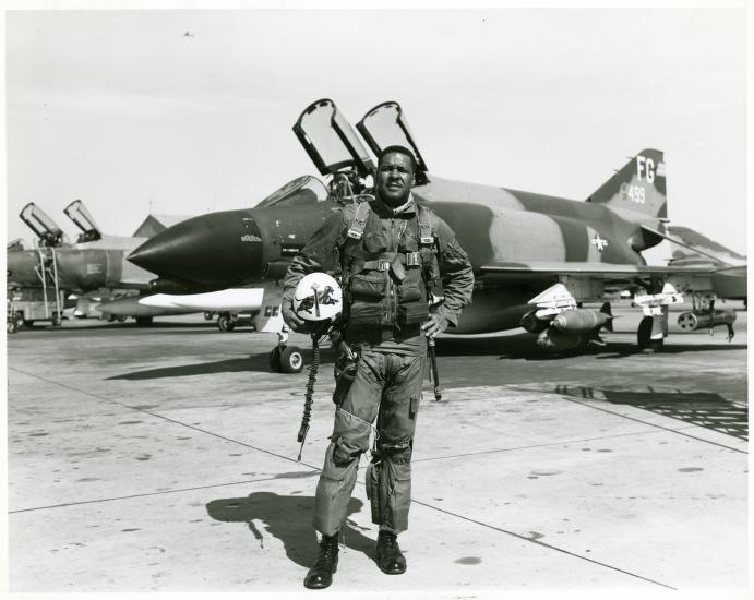 Daniel James Jr., an African-American male, poses formally in front of an aircraft.