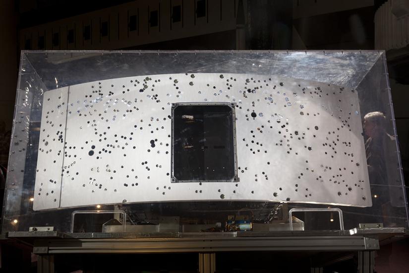 Rear end of planetary camera embedded in glass case.