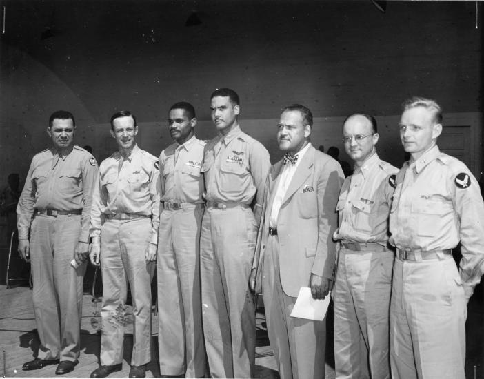 A group of Tuskegee Airmen trainees stand with commander Noel Parrish.