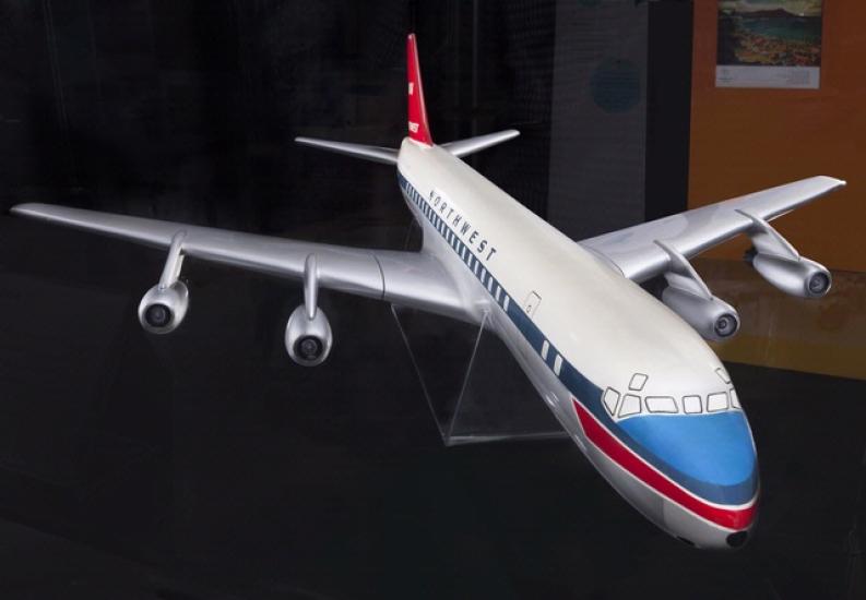 Front view of plastic commercial aircraft model with white, blue, and red livery. Northwest is painted on the side.