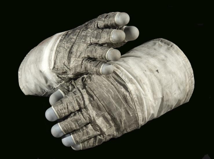 Pair of lunar gloves used on Apollo 17 mission. A special gray fabric makes up most of the gloves with the blue fingertips made from silicon rubber.