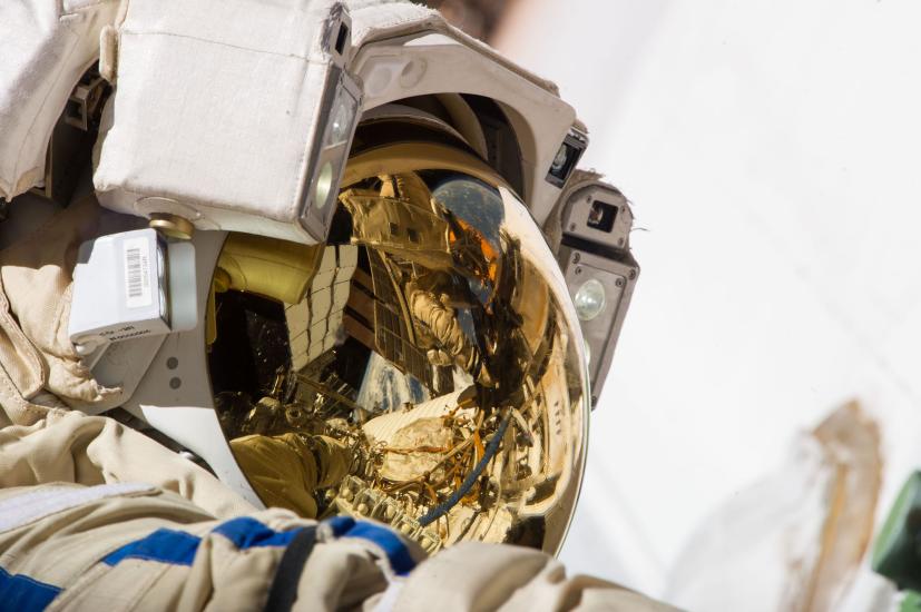 Close-up view of Cosmonaut Sergey Ryazanskiy, who is wearing his astronaut suit, during a spacewalk.