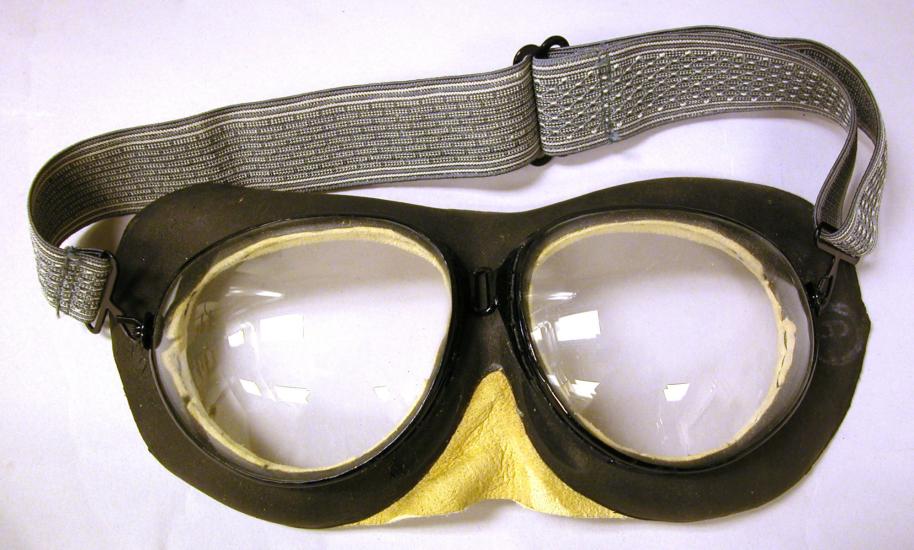 Black goggles with gray-colored fabric back strap.