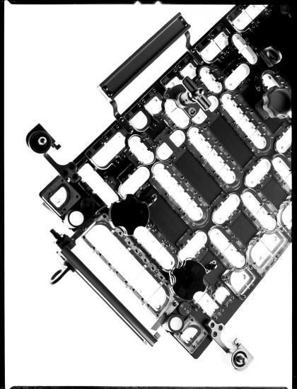 An art piece of a bottom section of a rectangular part of a Hubble Space Telescope spacewalk tool photographed. 