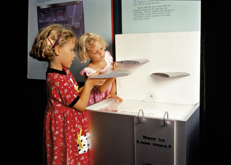 Two curious youngsters learn about wing shapes