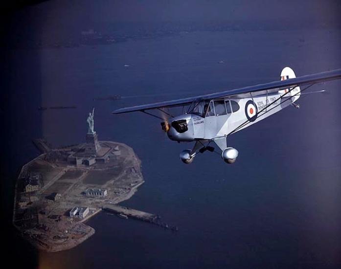 Piper J-3F Cub Flitfire over Statue of Liberty