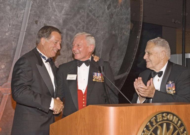 Jim Guyette, Jack Dailey and Don Lopez, three men, stand next to each other at a gala.