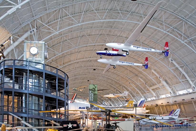 Global Flyer, a white and blue plane with very long wings, hangs on display at the Udvar-Hazy Center.