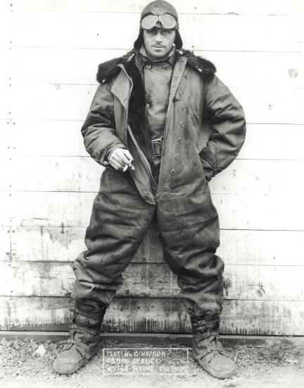 William Hopson, a white man, stands while wearing aviator gear.