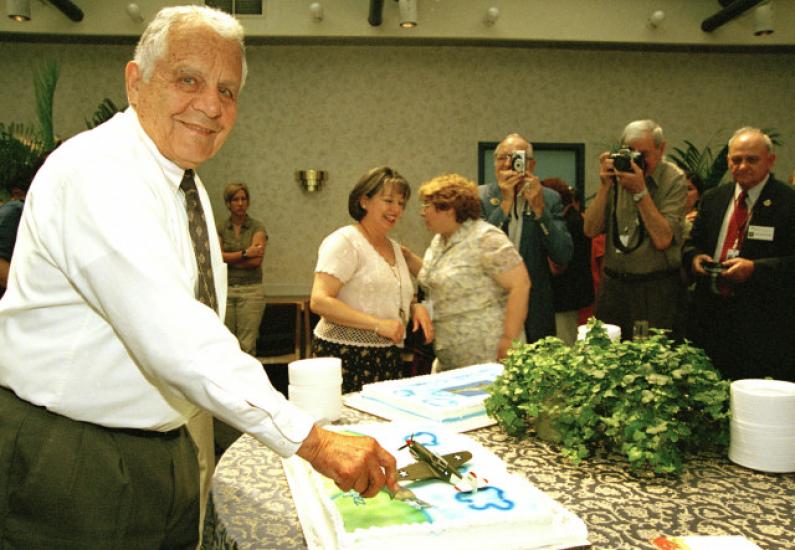 Don Lopez Cuts the Cake on his 80th Birthday