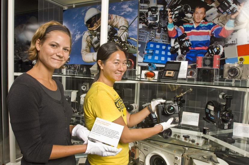 Museum Specialist installing the Space Camera Exhibit Case