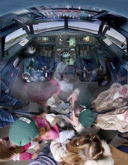 America by Air - cockpit reflecting children