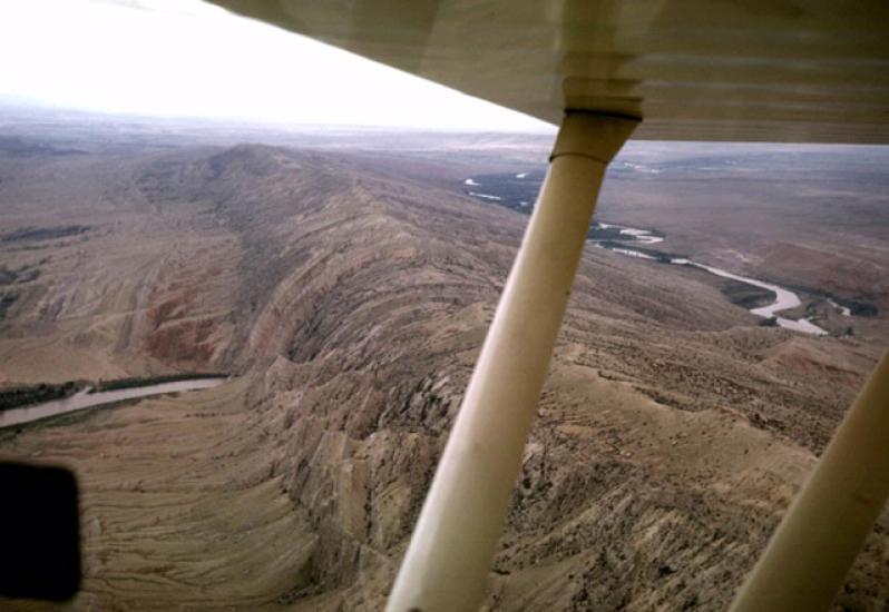 View of a mountain and valley from an airplane.