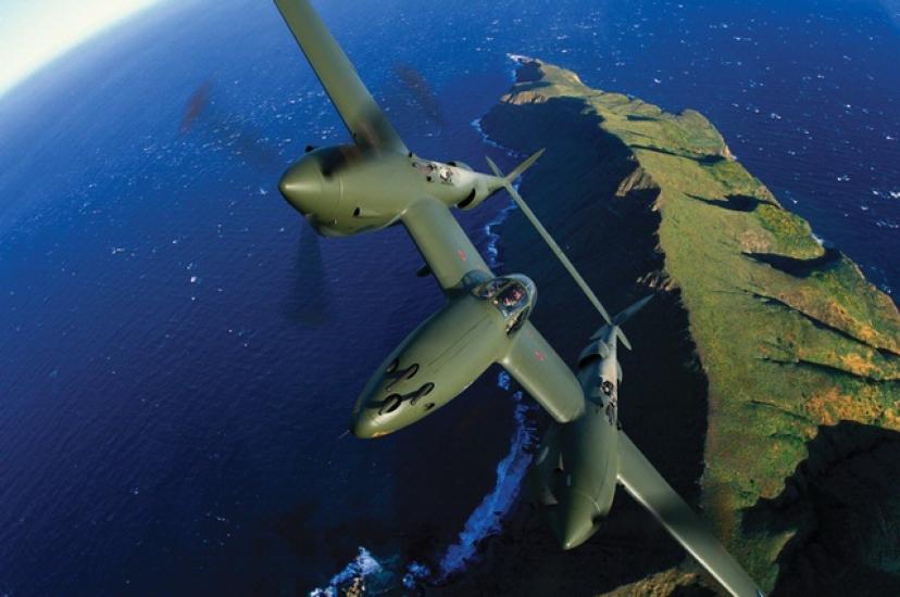 Glacier Girl P-38 in flight over coastline