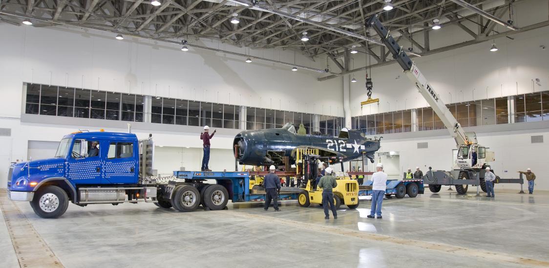 Staff Move <i>Helldiver</i> into Mary Baker Engen Restoration Hangar