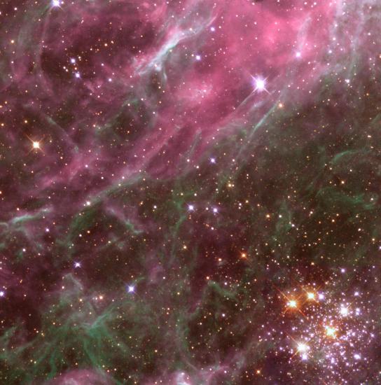 Stars are found throughout a gray and pink nebula.