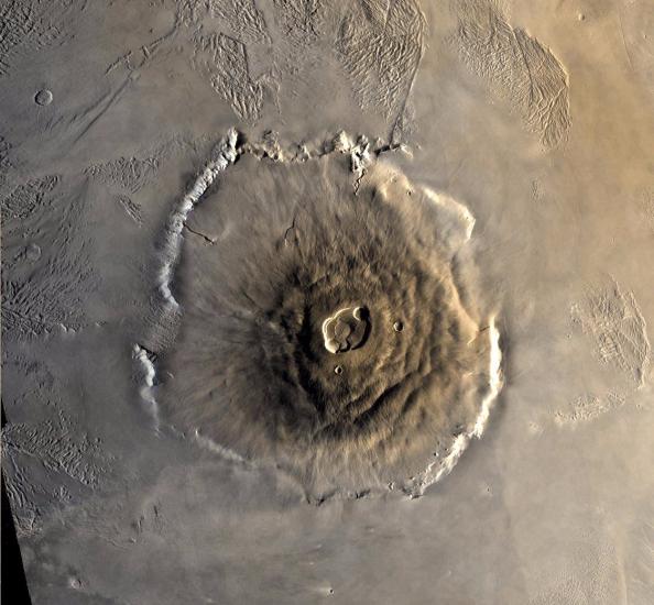 A satellite view of a large volcano on the surface of Mars.